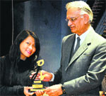 Governor Shivraj Patil honours a student at LPU near Jalandhar on Saturday. 