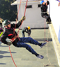 Employees of the Shri Mata Vaishno Devi Shrine Board attend the disaster preparedness and response programme at the shrine in Jammu on Saturday
