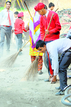 Students carry out a cleanliness drive at Government Senior Secondary School on the PAU campus.