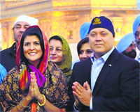 US Governor Nikki Haley and her husband Michael Haley at the Golden Temple in Amritsar on Saturday. Tribune Photo