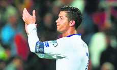 Portugals Cristiano Ronaldo celebrates their 1-0 victory over Armenia in their EURO 2016 Qualifier match in Faro on Friday.