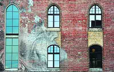 A photograph posted on a building by French graffiti artist and self-coined “photograffeur” JR is pictured in Berlin.