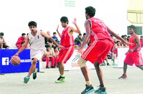 Doon International School and Aryan School basketball teams play in Dehradun on Saturday