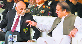 Afghan President Ashraf Ghani (L) with Pakistani Prime Minister Nawaz Sharif while watching a cricket match between their countries, in Islamabad on Saturday.