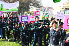 Students of The Millennium School take out a rally during a cleanliness drive launched by the school in Bathinda on Sunday