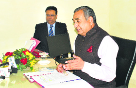 Justice Satish Kumar Mittal talks to the media in Rewari.