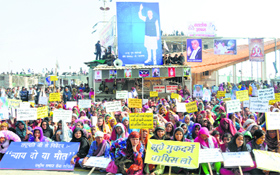 Women followers of Rampal gaurd the Satlok Ashram in Barwala on Sunday.