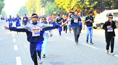 Youth take part in a marathon organised by the District Election Officer to create awareness about the significance of voting ahead of Assembly elections, in Jammu on Sunday. 