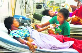 A woman recovers from a sterilisation operation at CIMS Hospital in Bilaspur on Sunday