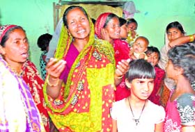 Family members mourn the death of a man shot during a clash between supporters of  the TMC and the BJP in Birbhum, WB