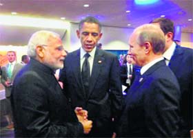 Prime Minister Narendra Modi, US President Barack Obama and Russian President Vladimir Putin during the G20 Summit in Brisbane on Saturday