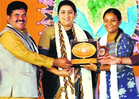 Union HRD Minister Smriti Irani presents an award to differently abled mountaineer Arunima Sinha at the ABVP national convention in Amritsar on Sunday
