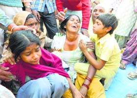 Grieving wife and children of victim Balveer Beera