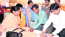 Marma Chikitsa expert Dr Sunil Joshi (right) treates a patient at the International Marma Vigyan Marma Chikitsa Training Programme at Prem Nagar in Haridwar on Sunday.