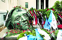 Red roses are placed at the monument dedicated to the 1973 students uprising against the former Greek military junta, on the eve of the 41st anniversary of the event, in Athens on Sunday