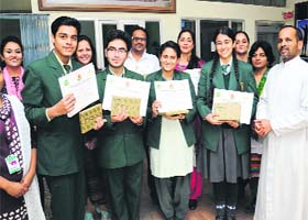 Students of St Xaviers School in a jubilant mood with their principal and teachers in Bathinda on Monday. The students had participated in various events conducted by the CBSE in Ludhiana