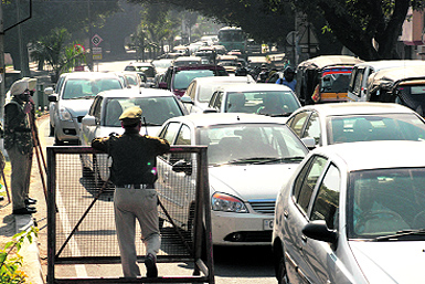 Vehicles stuck in a traffic jam near the Housing Board Chowk on Monday.