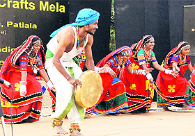 Artistes present a cultural dance during the National Crafts Mela at Kala Gram in Chandigarh. 
