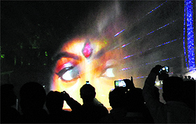 Visitors capture an image during the inaugration of the laser fountain at Sector 17, Chandigarh, on Monday. 