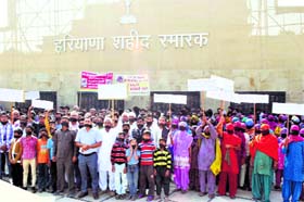 The family of ITBP jawan Kapil Sharma protest at Chandana village in Kaithal