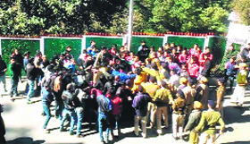 Students scuffle with cops during a protest in Himachal Pradesh University in Shimla on Monday.