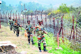 Army men maintain vigil on the LoC in the Sabzian sector of Poonch on Monday.