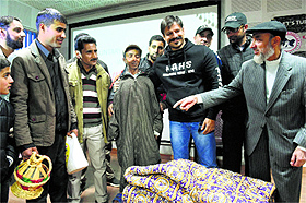 Actor Vivek Oberoi interacts with flood-hit people at a rehab centre in Srinagar on Monday. 