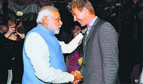 Prime Minister Narendra Modi with Australian cricketer Brett Lee in Sydney on Monday.