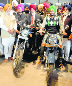 Cabinet Minister Surjit Rakhra (red turban) at the inauguration of a showroom in Patiala on Monday.