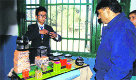 A student of Central School for Tibetans explains about the model at an exhibition in Mussoorie on Monday.