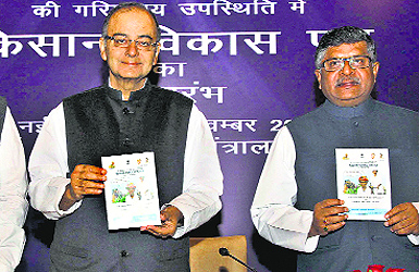 Union Finance Minister Arun Jaitley (L) and Union Communication & Information Technology Minister Ravi Shankar Prasad at the launch of Kisan Vikas Patras in New Delhi on Tuesday. 