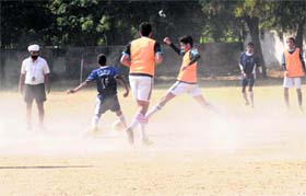 Players play amid cloud of dust at Government Model Senior Secondary School in Sector 37, Chandigarh, on Tuesday