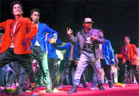 In sync: Artistes present a dance item during "Aaghaz 2014" at Panjab University on Tuesday