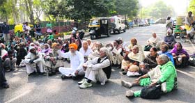 Pensioners hold a protest in Chandigarh on Tuesday