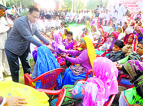 Rezang La Shaurya Samiti president Sanjay Rao honours war widows in Rewari on Tuesday. 