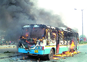 A roadways bus torched by infuriated kin of the deceased at Bahadurgarh in Jhajjar district on Tuesday. 