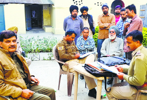 Relatives of the victim, Rajinder Singh, register a complaint at Indora in Kangra on Tuesday.