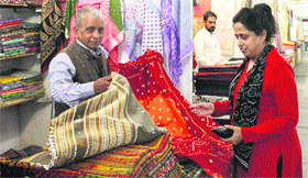A woman checks out handlooms during an exhibition at Desh Bhagat Yadgar Hall in Jalandhar.