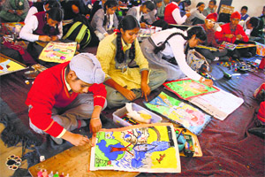 Students participate in a drawing competition at MGM School in Ludhiana on Tuesday