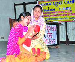 Students enact a scene from the play Sirjana at the Khalsa College for Women at Sidhwan Khurd near Jagraon