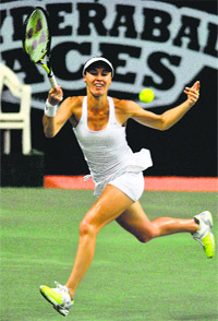 Martina Hingis of Hyderabad Aces plays a shot during her singles match against Agnieszka Radwanska of Pune Marathas at the Champions Tennis League in Hyderabad on Tuesday