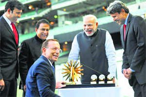 Indias Prime Minister Narendra Modi shares a light moment with former Indian cricketers VVS Laxman, Sunil Gavaskar and Kapil Dev after they presented Australian Prime Minister Tony Abbott a gift at the Melbourne Cricket Ground on Tuesday.