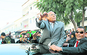 Tunisias President Moncef Marzouki, who is seeking re-election, greets supporters during a campaign rally in Tunis on Tuesday. The Tunisian presidential election is scheduled on November 23. 