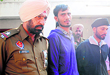 The robbers who were arrested by the police being taken to court in Amritsar on Wednesday