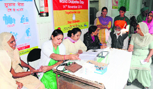 Diabtetes test being conducting during the camp at the Civil Hospital to mark the World Diabetes Day in Bathinda on Wednesday.