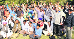 Members of the BSNL Contract Labourers Union shout slogans demanding release of their salaries at Childrens Park in Bathinda on Wednesday.