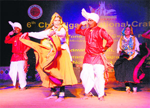 Artistes present a folk dance of Haryana during the Chandigarh National Crafts Mela at Kala Gram in Chandigarh on Wednesday