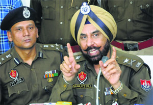 Paramjit Singh Gill (right), IGP, Patiala Zone, and RK Jaiswal, DIG, Ropar Range, brief the media about the case in Mohali on Wednesday