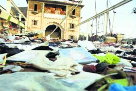 Picking up the pieces: This view outside Satlok Ashram in Barwala speaks volumes about the enormity of the clash between the police and Rampal followers