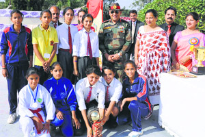 Meritorious students with dignitaries during the annual day function of Army Public School, BD Bari, in Jammu.